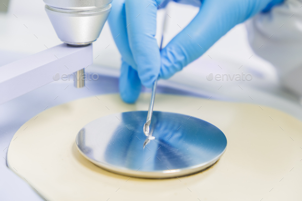 The chemist is testing identification test for raw material with FTIR spectrometer. - Stock Photo - Images
