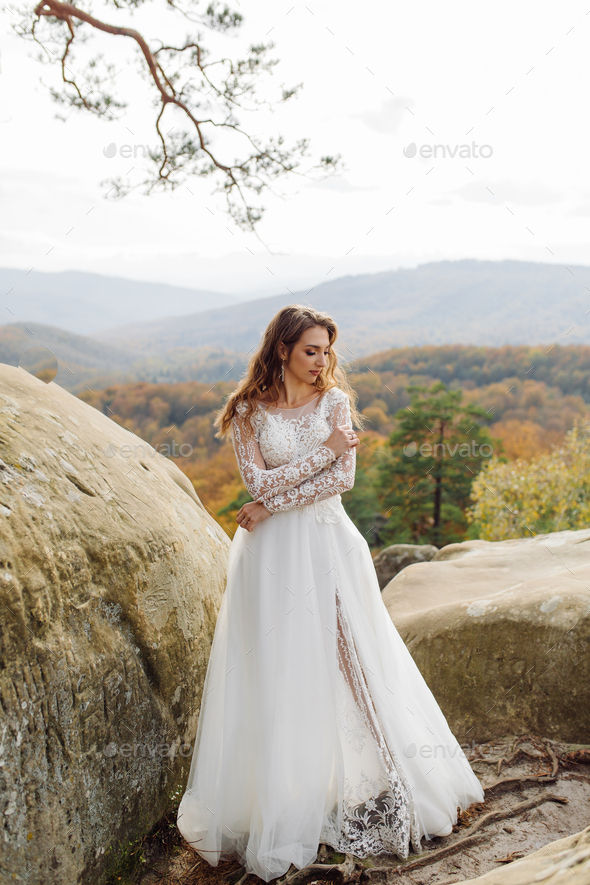 Beautiful bride in white dress posing. - Stock Photo - Images