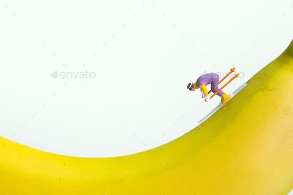 a skier rides downhill on a banana