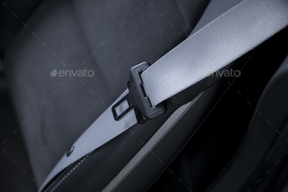 Closeup shot of the silver belt in the modern car interior