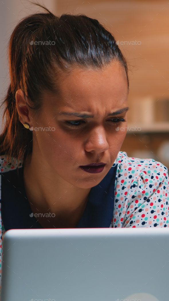 Freelancer squinting while reading emails Stock Photo by DC_Studio