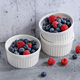 Fresh berries in small bowls on grey - PhotoDune Item for Sale