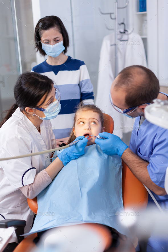 Little girl getting treatment for caries