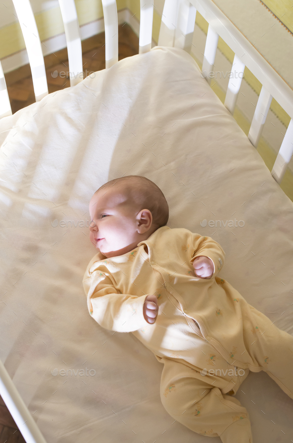 Baby in a bed - Stock Photo - Images