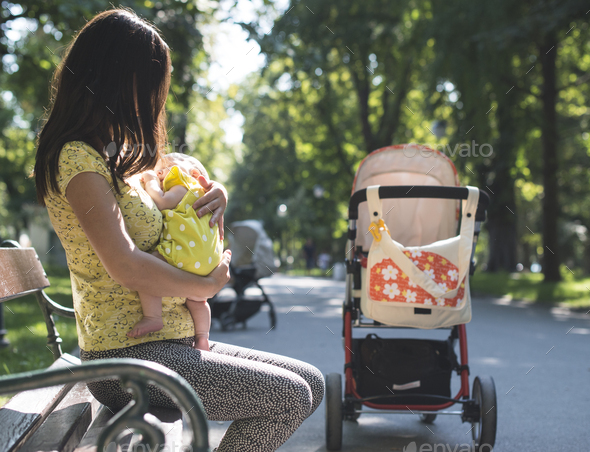 Woman with baby in hands. - Stock Photo - Images