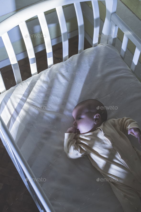 Baby in a bed - Stock Photo - Images
