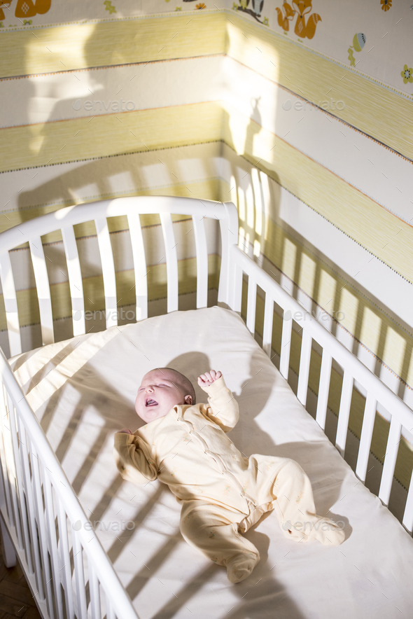 Cryng baby in the bed - Stock Photo - Images