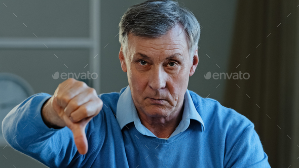 Portrait Of Upset Angry Sad Elderly Man Looking At Camera Disgruntled