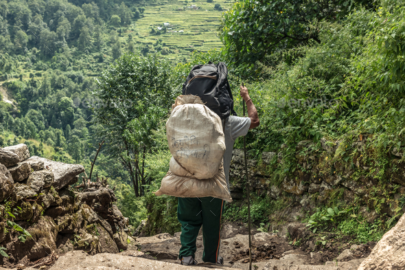 Man with sack on Annapurna trekking route.