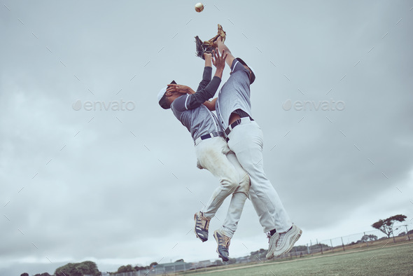 Sports, action and a men catch baseball, jump in air with ball in baseball glove. Energy, sport and