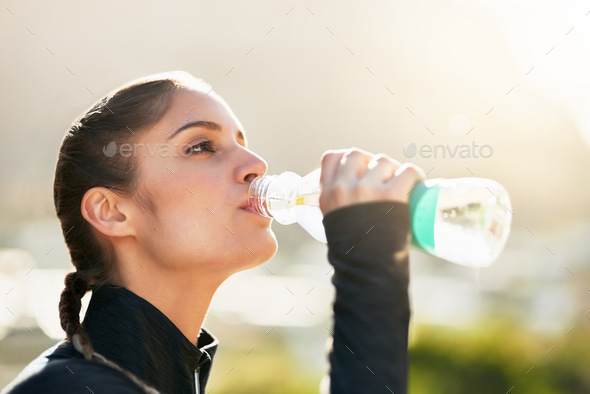 Its Important Stay Hydrated Young Woman Drinking Her Water Bottle Stock  Photo by ©PeopleImages.com 658049610