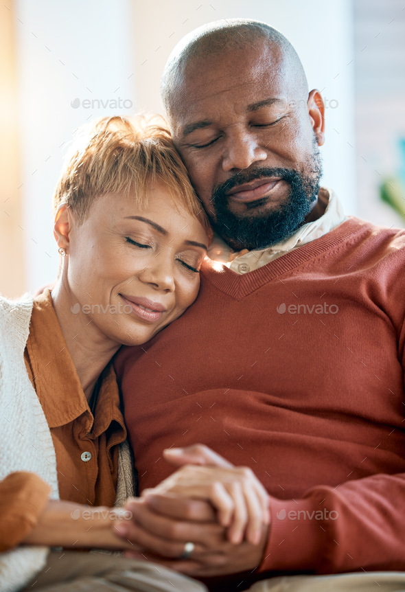 Senior black couple, holding hands on sofa or comfort bonding care with