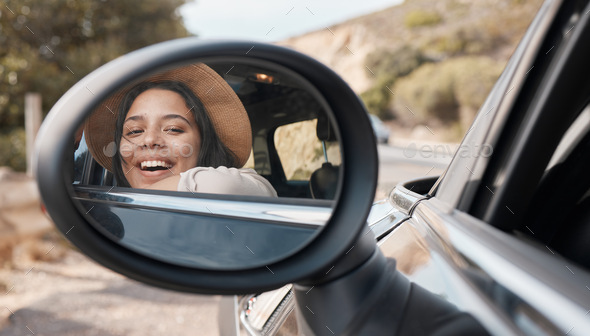 Car mirror, happy road trip and black woman feeling happy about motor transport and freedom. Travel