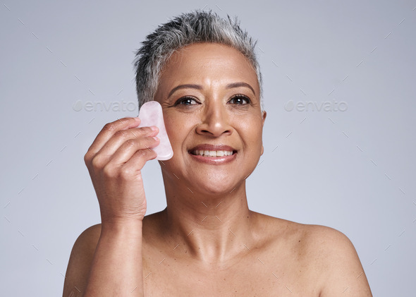 Elderly, woman and portrait of massage with gua sha stone for wellness, circulation and beauty. Ski - Stock Photo - Images