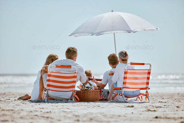 Beach, umbrella and big family on a summer vacation, trip or seaside journey together in Australia.