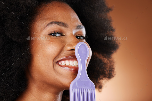 Natural hair, hair care and black woman with comb, beauty portrait with cosmetic advertising agains