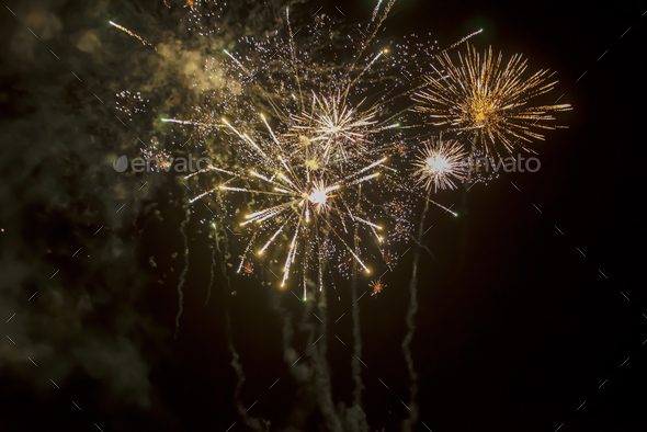 firework explosion from beautiful stars, splashes, sparks and bright lines of lights