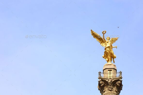 Beautiful shot of the Angel of Independence under the blue sky in Mexico City - Stock Photo - Images