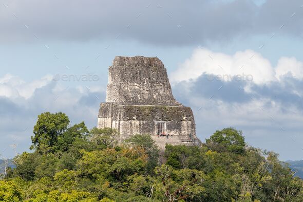 Temple 4 or IV ancient mayan ruins above the jungle forest in tikal guatemala