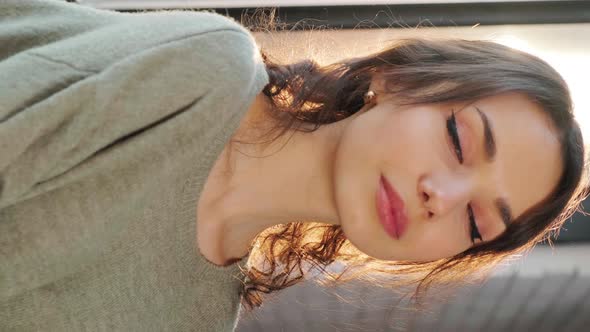 Woman Staying Near Window and Flirting at the Camera the Sun Illuminate Her Face alt