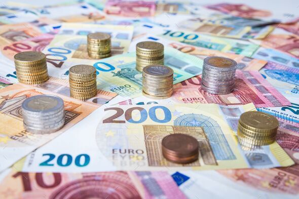 A combination of different Euro banknotes and Euro coins - Stock Photo - Images