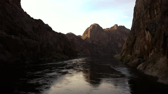 4k Aerial view from drone flying over the Colorado River with views of beautiful red rocks alt
