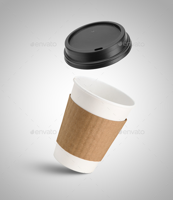 White paper coffee cup and black lid in the air - Stock Photo - Images