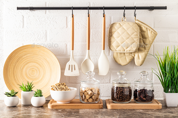 various kitchen utensils against abrick wall in the modern kitchen. kitchen background. ECO items.