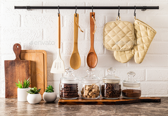 Beautiful kitchen background with various glass jars for bulk products. modern kitchen decor.