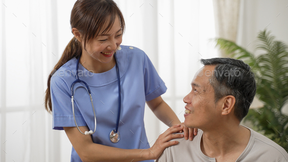 nursing aide talking and encouraging older male
