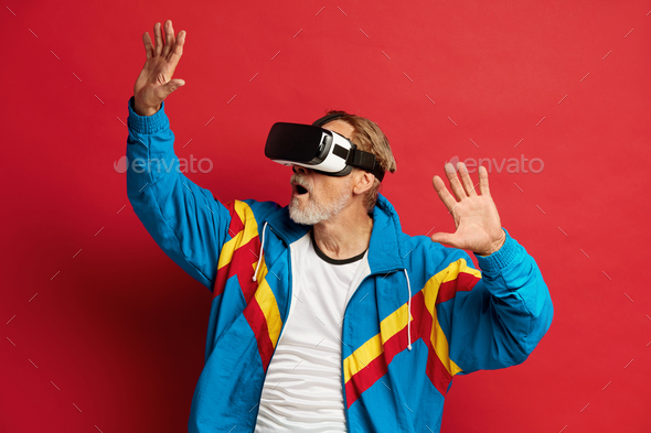 Senior Man Trying VR. Portrait of Amazed Grandfather Discovering Technologies