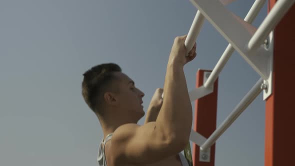 Man Doing Pullups Exercises alt