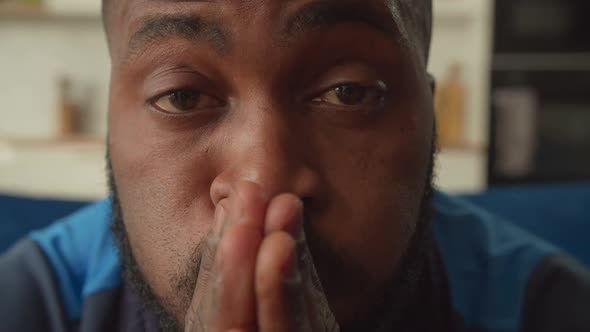 Portrait of Disappointed African Man Looking with Frustrated Expression Indoor alt