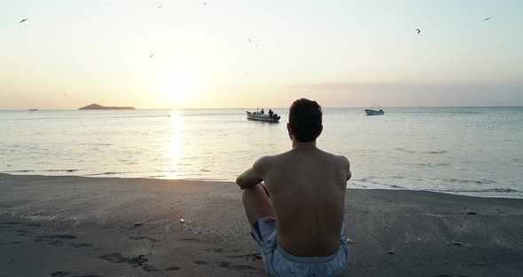 Man on the Tropical Beach Looking at Sunset, Meditate Relax, Psychological Therapy, Reflection