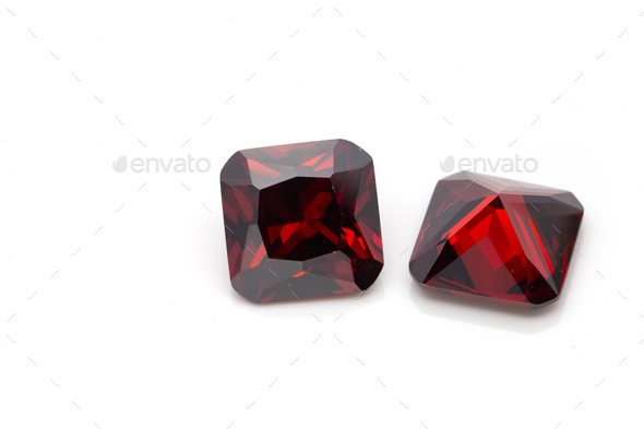 Closeup of red ruby gemstones isolated on a white background