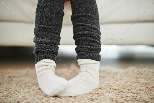 Life is better in socks. Cropped shot of a woman wearing socks and leg warmers.