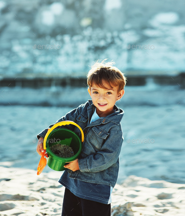 I cant wait to begin building my sand castle. Shot of a young boy at the beach.