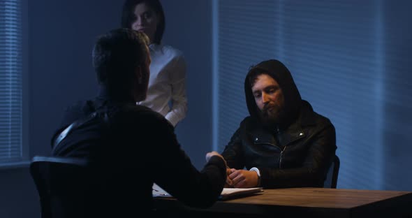 Investigators Interrogating a Criminal alt