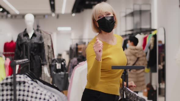 Mature Active Woman Seller in Protective Mask Funny Dancing Energetic Dance Promoting Advertising alt