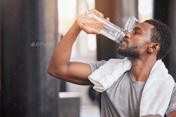 Premium Photo  Black man drink water fitness and gym with challenge workout  training for muscle and thirsty with motivation goals and sweating tired  sports athlete person with water bottle in health