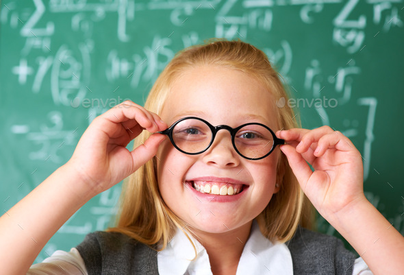 Let Me Put My Glasses On First. Portrait Of A Cute Blonde Girl 