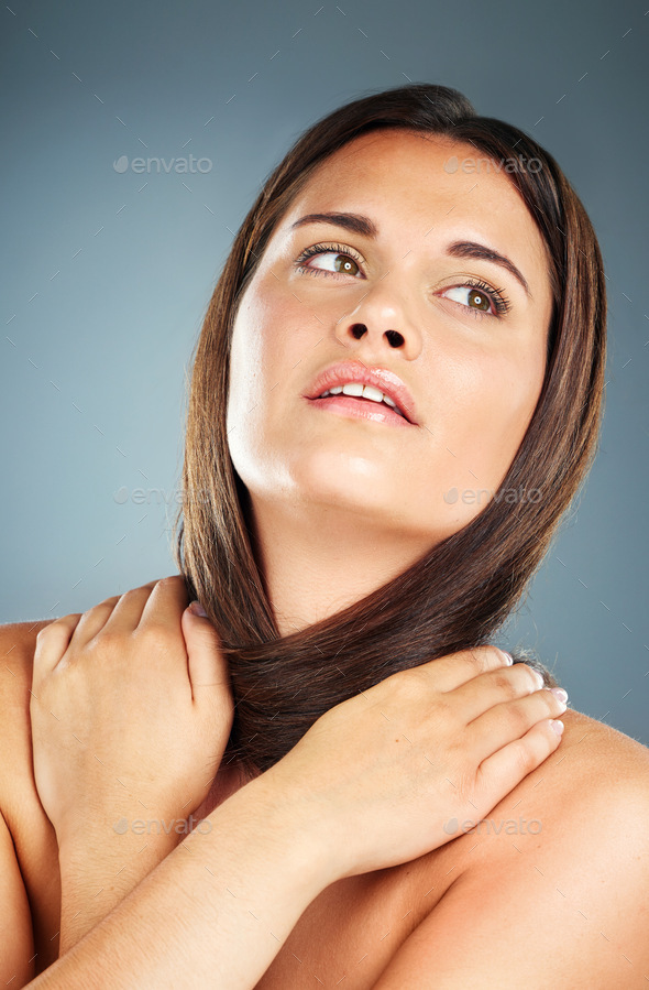 Self love, thinking and woman with hug for beauty, hair care and skincare against a blue background