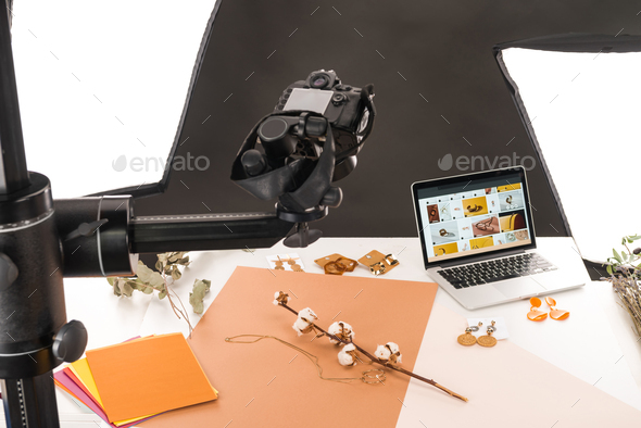 composition with cotton flower and accessories for photo shooting with camera and laptop - Stock Photo - Images