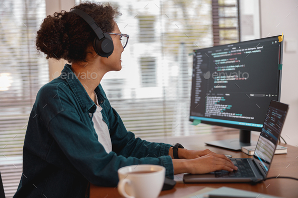 Freelancer female making new project as web designer and programmer on her computer at home - Stock Photo - Images