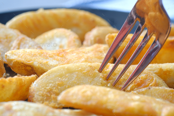 Tasty freshly made wage potato chips in a plate  - Stock Photo - Images