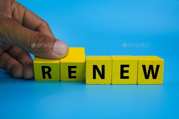 yellow wooden cube with the word renew. Time to renew. - Stock Photo - Images