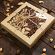 Nuts of different varieties in a box on a structural wooden background top view. - PhotoDune Item for Sale