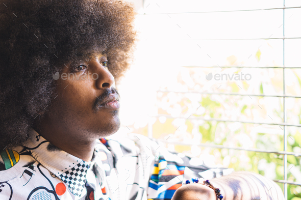 young black guy with afro hair in profile