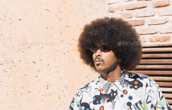 young black guy with mustache and sunglasses with afro hair