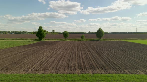 Agriculture Farm Fields Growing in naturePlow Ground Soil For Sowing Aerial Low Angle Flight alt